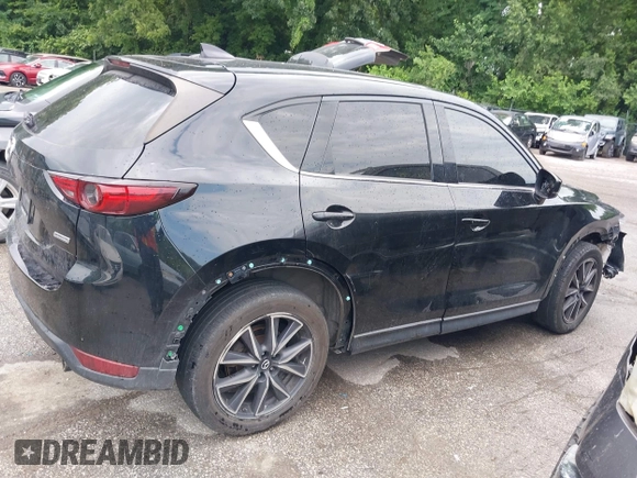 2018 Mazda CX-5 Grand Touring with VIN JM3KFBDM2J0400828, listed as a IAAI auction lot 42540846 with 254,672 mi miles and . Bid and sale history available at DreamBid. Image 13.