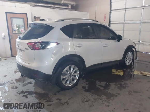 2013 Mazda CX-5 Grand Touring with VIN JM3KE4DE8D0147851, listed as a IAAI auction lot 41570695 with 94,648 mi miles. Bid and sale history available at carsss.com. Image 4.