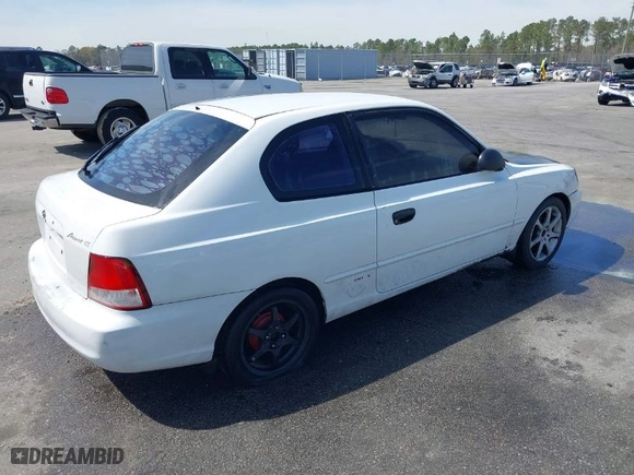 2002 Hyundai Accent GL with VIN KMHCG35C32U213819, listed as a IAAI auction lot 41834267 with 167,798 mi miles. Bid and sale history available at carsss.com. Image 4.
