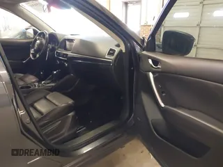 2016 Mazda CX-5 Grand Touring with VIN JM3KE2DYXG0846787, listed as a IAAI auction lot 41346364 with 113,553 mi miles. Bid and sale history available at carsss.com. Image 5.