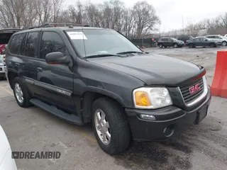2004 GMC Envoy SLE z VIN 1GKDT13S242364365, wystawiony jako IAAI lot #41097079 z przebiegiem 237 426 mil mil oraz . Historia ofert i sprzedaży dostępna na DreamBid. Obrazek 1.