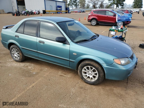 2001 Mazda Protege DX with VIN JM1BJ222310433605, listed as a Copart auction lot 49156215 with 205,146 mi miles and Salvage Title. Bid and sale history available at carsss.com. Image 4.