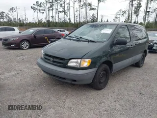 2000 Toyota Sienna CE with VIN 4T3ZF19C7YU240601, listed as a IAAI auction lot 41709617 with 999,999 mi miles. Bid and sale history available at carsss.com. Image 2.