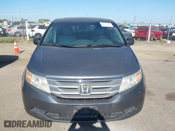 2012 Honda Odyssey EX-L with VIN 5FNRL5H6XCB061026, listed as a IAAI auction lot 42574612 with 144,480 mi miles and . Bid and sale history available at DreamBid. Image 12.