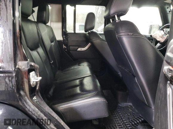 2015 Jeep Wrangler Unlimited Rubicon Hard Rock with VIN 1C4HJWFG4FL676868, listed as a Copart auction lot 48489525 with 100,771 mi miles and Salvage title. Bid and sale history available at DreamBid. Image 10.