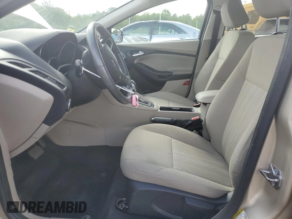 2017 Ford Focus SE z VIN 1FADP3F2XHL335127, wystawiony jako Copart lot #56119005 z przebiegiem 58 272 mil mil oraz Szkoda całkowita • Salvage title. Historia ofert i sprzedaży dostępna na DreamBid. Obrazek 7.