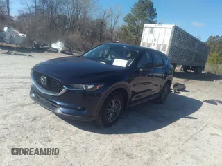 2020 Mazda CX-5 Touring with VIN JM3KFACM1L1817303, listed as a IAAI auction lot 41627859 with 57,268 mi miles. Bid and sale history available at carsss.com. Image 17.