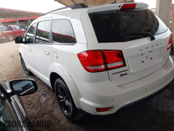 2019 Dodge Journey SE with VIN 3C4PDCBB7KT797842, listed as a IAAI auction lot 42036147 with 163,919 mi miles and . Bid and sale history available at DreamBid. Image 3.
