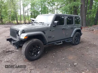 2021 Jeep Wrangler Unlimited Sahara with VIN 1C4HJXEG0MW703812, listed as a IAAI auction lot 42186089 with 50,349 mi miles and . Bid and sale history available at DreamBid. Image 2.