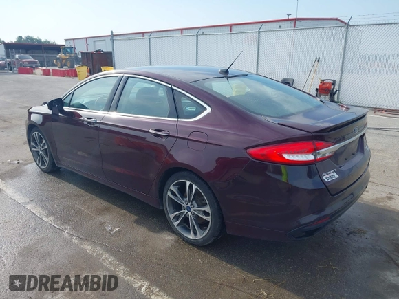 2017 Ford Fusion Titanium z VIN 3FA6P0K94HR271307, wystawiony jako IAAI lot #42595411 z przebiegiem 100 344 mil mil oraz . Historia ofert i sprzedaży dostępna na DreamBid. Obrazek 3.