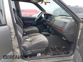 1997 Jeep Grand Cherokee Laredo with VIN 1J4GZ58S4VC745129, listed as a IAAI auction lot 41641005 with 1 mi miles. Bid and sale history available at carsss.com. Image 5.