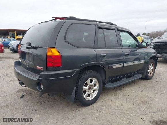 2004 GMC Envoy SLE with VIN 1GKDT13S642431159, listed as a IAAI auction lot 41511508 with 132,653 mi miles. Bid and sale history available at carsss.com. Image 4.