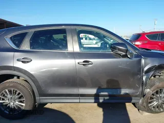 2017 Mazda CX-5 Touring with VIN JM3KFBCL2H0165625, listed as a IAAI auction lot 41879145 with 64,745 mi miles. Bid and sale history available at carsss.com. Image 13.