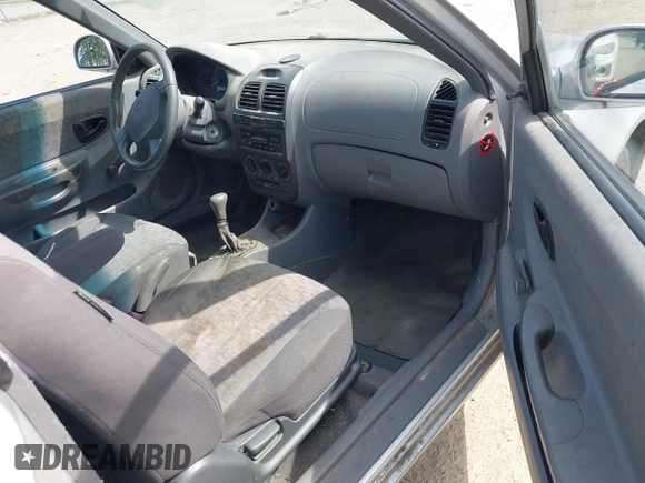 2005 Hyundai Accent GLS with VIN KMHCG35C65U332999, listed as a IAAI auction lot 42097932 with 225,593 mi miles. Bid and sale history available at carsss.com. Image 5.
