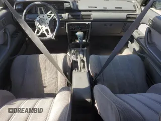 1991 Toyota Camry DLX z VIN 4T1SV21E7MU414824, wystawiony jako Copart lot #61604434 z przebiegiem 170 867 mil mil oraz Szkoda całkowita • Salvage title. Historia ofert i sprzedaży dostępna na DreamBid. Obrazek 8.