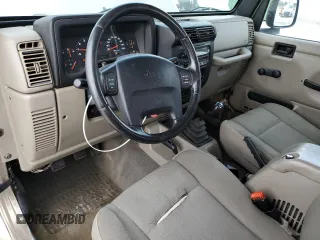 2003 Jeep Wrangler Sahara with VIN 1J4FA59S13P312830, listed as a Copart auction lot 52730955 with 99,247 mi miles and Salvage title. Bid and sale history available at DreamBid. Image 8.