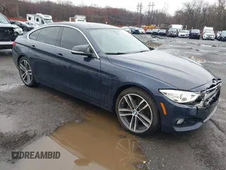 2016 BMW 4 Series 428i xDrive with VIN WBA4C9C59GG137067, listed as a IAAI auction lot 41913733 with 104,378 mi miles and . Bid and sale history available at carsss.com. Image 1.