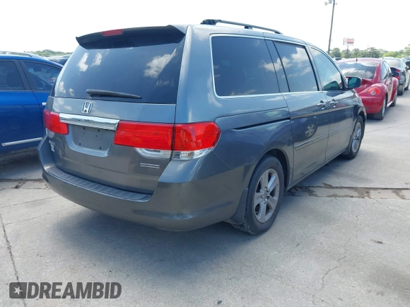 2010 Honda Odyssey Touring with VIN 5FNRL3H90AB053710, listed as a IAAI auction lot 42577646 with 255,351 mi miles and . Bid and sale history available at DreamBid. Image 4.