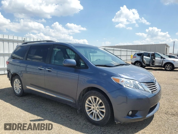 2015 Toyota Sienna XLE with VIN 5TDYK3DC4FS619385, listed as a Copart auction lot 57090385 with 112,896 mi miles and Salvage title. Bid and sale history available at DreamBid. Image 4.
