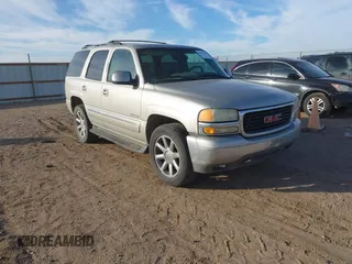 2004 GMC Yukon SLE z VIN 1GKEC13VX4R140721, wystawiony jako IAAI lot #41501269 z przebiegiem Nie podano mil oraz . Historia ofert i sprzedaży dostępna na DreamBid. Obrazek 1.
