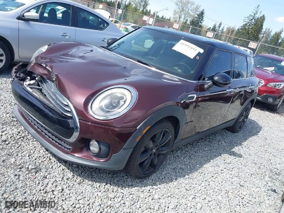 2016 MINI Cooper Clubman with VIN WMWLN5C57G2E30917, listed as a IAAI auction lot 41992494 with 38,567 mi miles. Bid and sale history available at carsss.com. Image 2.