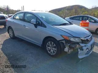 2012 Honda Civic Sdn LX with VIN 2HGFB2F51CH504335, listed as a IAAI auction lot 42016176 with 101,466 mi miles. Bid and sale history available at carsss.com. Image 1.