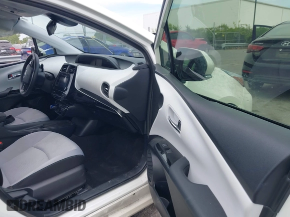 2019 Toyota Prius L Eco z VIN JTDKARFU3K3102222, wystawiony jako IAAI lot #42291403 z przebiegiem 27 669 mil mil oraz . Historia ofert i sprzedaży dostępna na DreamBid. Obrazek 5.
