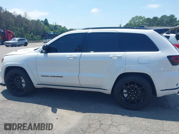 2019 Jeep Grand Cherokee Summit with VIN 1C4RJFJT1KC785744, listed as a IAAI auction lot 42645006 with 38,483 mi miles and . Bid and sale history available at DreamBid. Image 14.