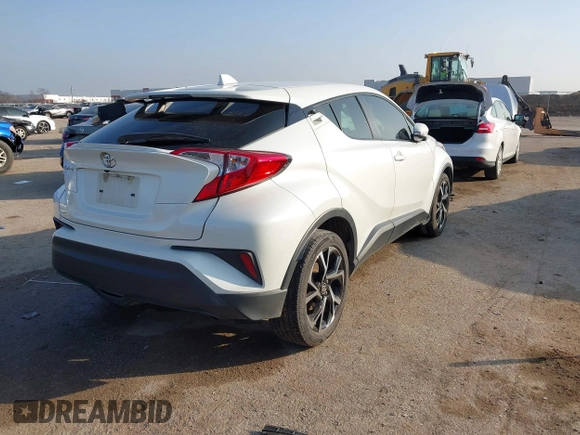 2021 Toyota C-HR LE with VIN JTNKHMBXXM1099019, listed as a IAAI auction lot 41525170 with 63,519 mi miles. Bid and sale history available at carsss.com. Image 4.