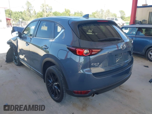 2021 Mazda CX-5 Touring with VIN JM3KFBCM3M0406787, listed as a IAAI auction lot 41800564 with 42,254 mi miles and . Bid and sale history available at carsss.com. Image 3.