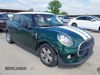 2016 MINI Hardtop 4 Door z VIN WMWXU1C52G2D10035, wystawiony jako IAAI lot #42190544 z przebiegiem 106 383 mil mil oraz . Historia ofert i sprzedaży dostępna na DreamBid. Obrazek 1.