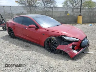 2016 Tesla Model S 90D with VIN 5YJSA1E42GF127593, listed as a Copart auction lot 52450495 with 144,151 mi miles and Salvage title. Bid and sale history available at DreamBid. Image 4.
