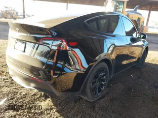 2023 Tesla Model Y Long Range with VIN 7SAYGDEE8PF815622, listed as a IAAI auction lot 41515433 with 70,862 mi miles and . Bid and sale history available at DreamBid. Image 4.