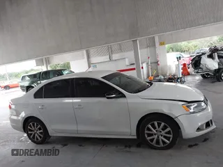 2014 Volkswagen Jetta SE z VIN 3VWD17AJ3EM265396, wystawiony jako IAAI lot #42434771 z przebiegiem 114 931 mil mil oraz . Historia ofert i sprzedaży dostępna na DreamBid. Obrazek 13.