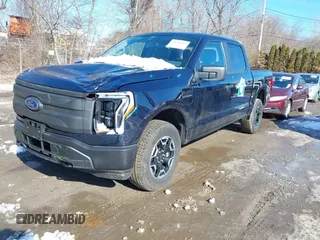 2023 Ford F-150 Lightning Pro with VIN 1FTVW1EL7PWG07081, listed as a IAAI auction lot 38702102 with 9,976 mi miles and . Bid and sale history available at DreamBid. Image 19.