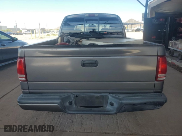 2001 Dodge Dakota Sport z VIN 1B7HL2AN21S298590, wystawiony jako Copart lot #54430385 z przebiegiem 175 365 mil mil oraz Szkoda całkowita • Salvage title. Historia ofert i sprzedaży dostępna na DreamBid. Obrazek 6.