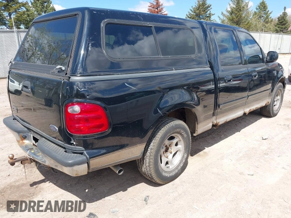 2003 Ford F-150 XLT with VIN 1FTRW07613KC71609, listed as a IAAI auction lot 42186741 with 190,591 mi miles. Bid and sale history available at carsss.com. Image 4.