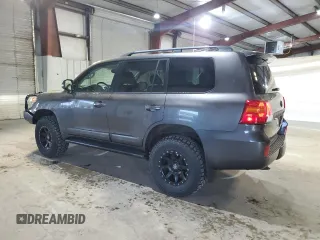 2013 Toyota Land Cruiser z VIN JTMHY7AJ7D4009899, wystawiony jako Copart lot #56848645 z przebiegiem 203 129 mil mil oraz Tytuł czysty. Historia ofert i sprzedaży dostępna na DreamBid. Obrazek 2.