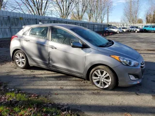 2013 Hyundai Elantra GT with VIN KMHD35LE9DU037412, listed as a Copart auction lot 79561274 with 54,619 mi miles and Salvage Title. Bid and sale history available at carsss.com. Image 4.