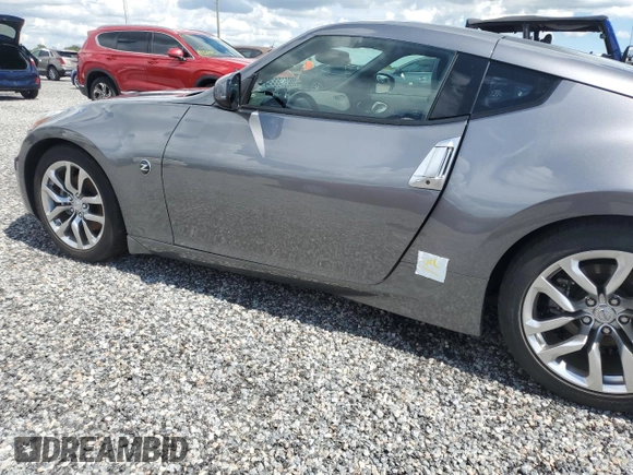 2014 Nissan 370Z with VIN JN1AZ4EH6EM633797, listed as a Copart auction lot 74027354 with Not Provided miles and Salvage Title. Bid and sale history available at DreamBid. Image 12.