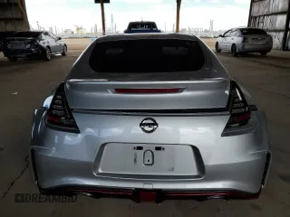 2015 Nissan 370Z Nismo z VIN JN1AZ4EH1FM441060, wystawiony jako Copart lot #53423725 z przebiegiem Nie podano mil oraz Szkody całkowita. Historia ofert i sprzedaży dostępna na DreamBid. Obrazek 6.