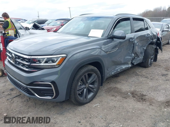 2022 Volkswagen Atlas SEL R-Line z VIN 1V2SE2CA2NC208363, wystawiony jako IAAI lot #41850237 z przebiegiem 38 867 mil mil oraz . Historia ofert i sprzedaży dostępna na DreamBid. Obrazek 2.