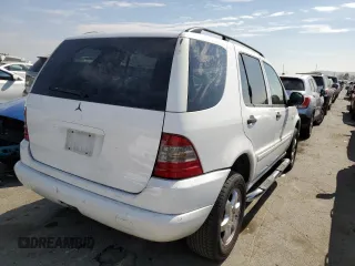2000 Mercedes-Benz M-Class with VIN 4JGAB54E5YA165660, listed as a Copart auction lot 65872364 with 115,668 mi miles and Salvage Title. Bid and sale history available at carsss.com. Image 3.