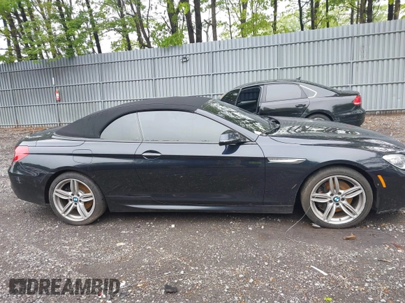 2017 BMW 6 Series 650i xDrive z VIN WBA6F7C52HD930816, wystawiony jako IAAI lot #42168478 z przebiegiem 89 191 mil mil oraz . Historia ofert i sprzedaży dostępna na DreamBid. Obrazek 13.