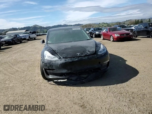 2019 Tesla Model 3 Mid Range with VIN 5YJ3E1EAXKF311719, listed as a Copart auction lot 44570825 with 143,034 mi miles and Salvage Title. Bid and sale history available at carsss.com. Image 11.