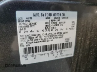 2019 Ford Edge SEL z VIN 2FMPK4J9XKBC67141, wystawiony jako Copart lot #60271615 z przebiegiem 100 400 mil mil oraz Szkoda całkowita • Salvage title. Historia ofert i sprzedaży dostępna na DreamBid. Obrazek 13.