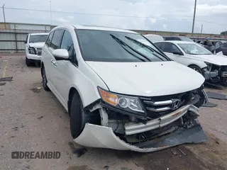 2016 Honda Odyssey Touring Elite z VIN 5FNRL5H97GB059217, wystawiony jako IAAI lot #41909106 z przebiegiem 147 203 mil mil oraz . Historia ofert i sprzedaży dostępna na DreamBid. Obrazek 1.