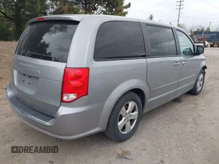 2014 Dodge Grand Caravan American Value with VIN 2C4RDGBG0ER168085, listed as a IAAI auction lot 42020959 with 213,383 mi miles and . Bid and sale history available at DreamBid. Image 4.