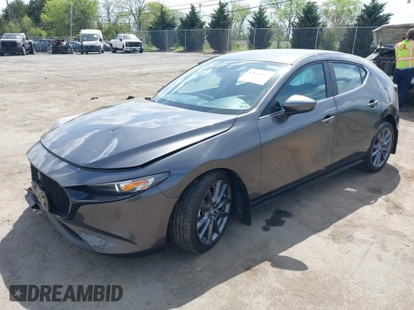 2023 Mazda 3 S Select with VIN JM1BPAKM3P1615785, listed as a IAAI auction lot 42064302 with 63,928 mi miles and . Bid and sale history available at DreamBid. Image 2.