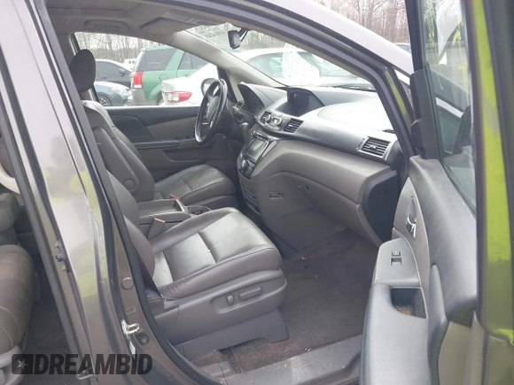 2014 Honda Odyssey Touring with VIN 5FNRL5H94EB020257, listed as a IAAI auction lot 41924245 with 204,526 mi miles and . Bid and sale history available at DreamBid. Image 5.